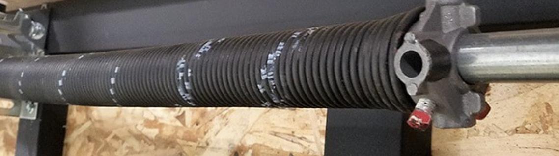 Torsion spring system and shaft on a garage door